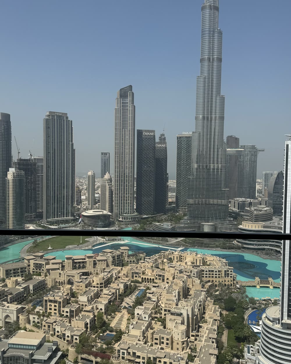 Downtown Dubai by day, with the Burj Khalifa rising over the towers and the fountain lake